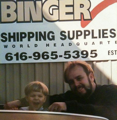Binger-family-photo-with-original-binger-sign